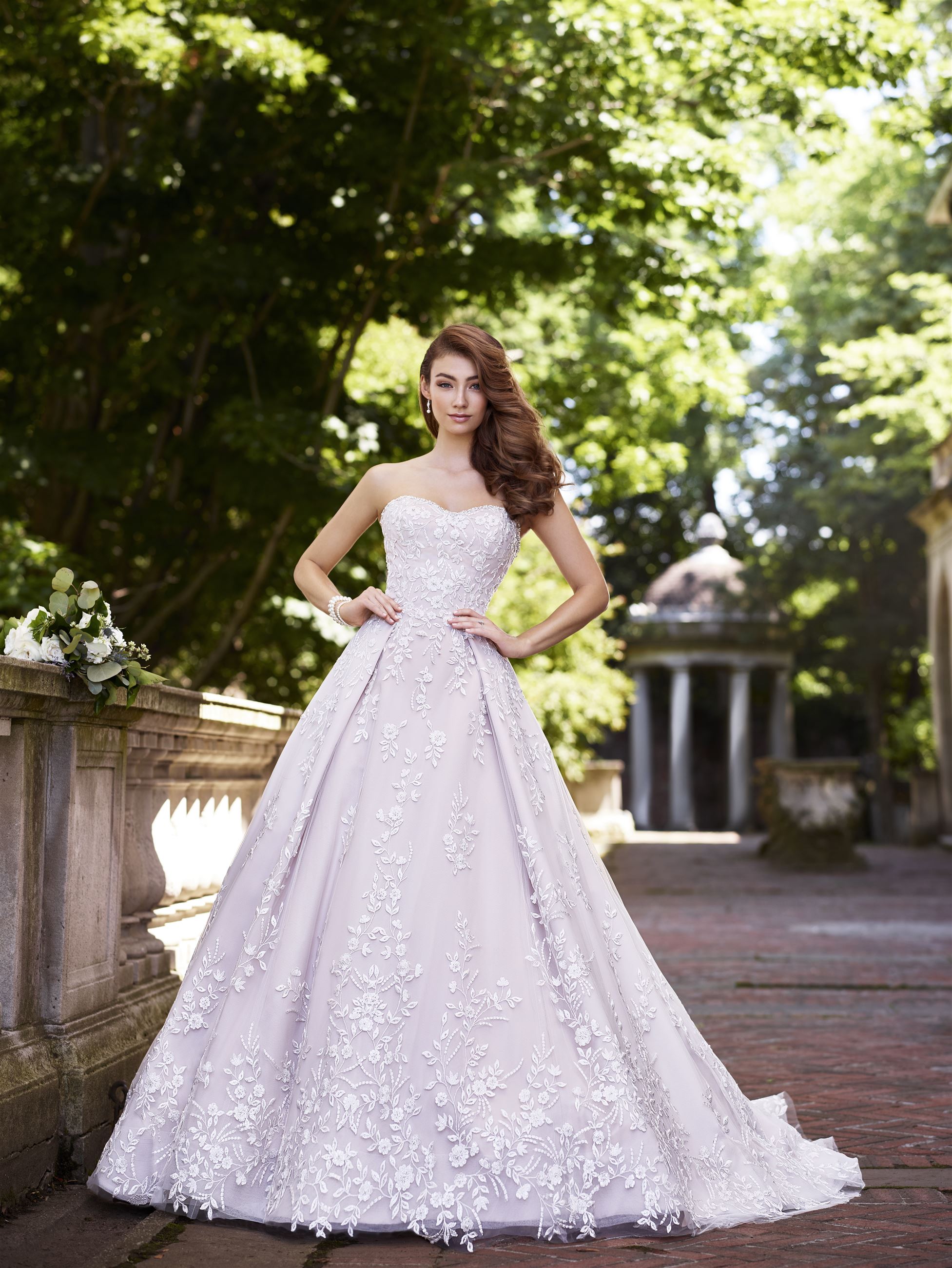 Bride wearing floral lace ball gown wedding dress
