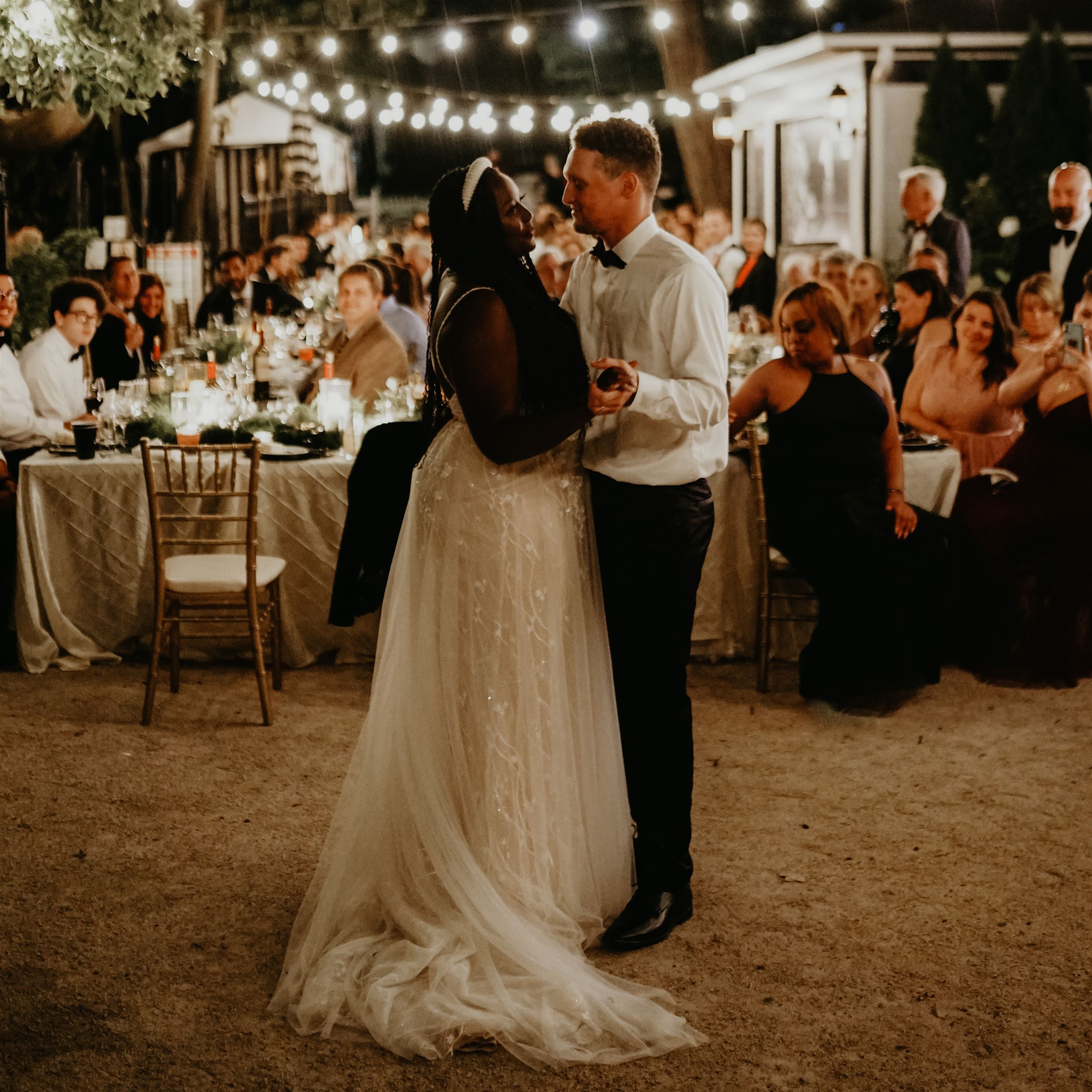 Bride and groom dancing together after their wedding reception