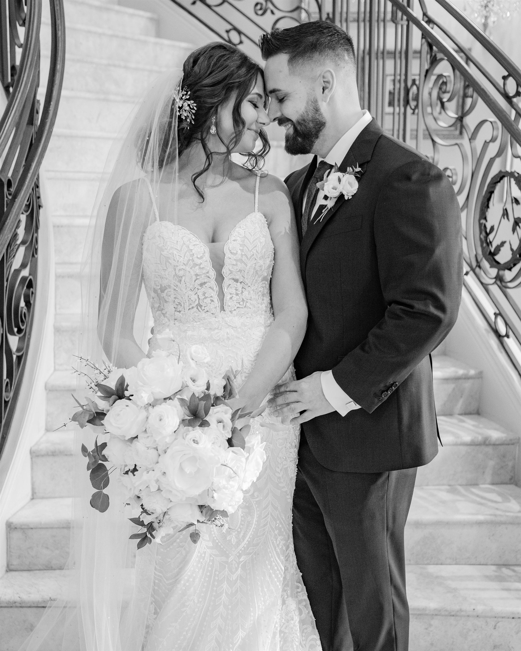 Black and white image of bride and groom on wedding day