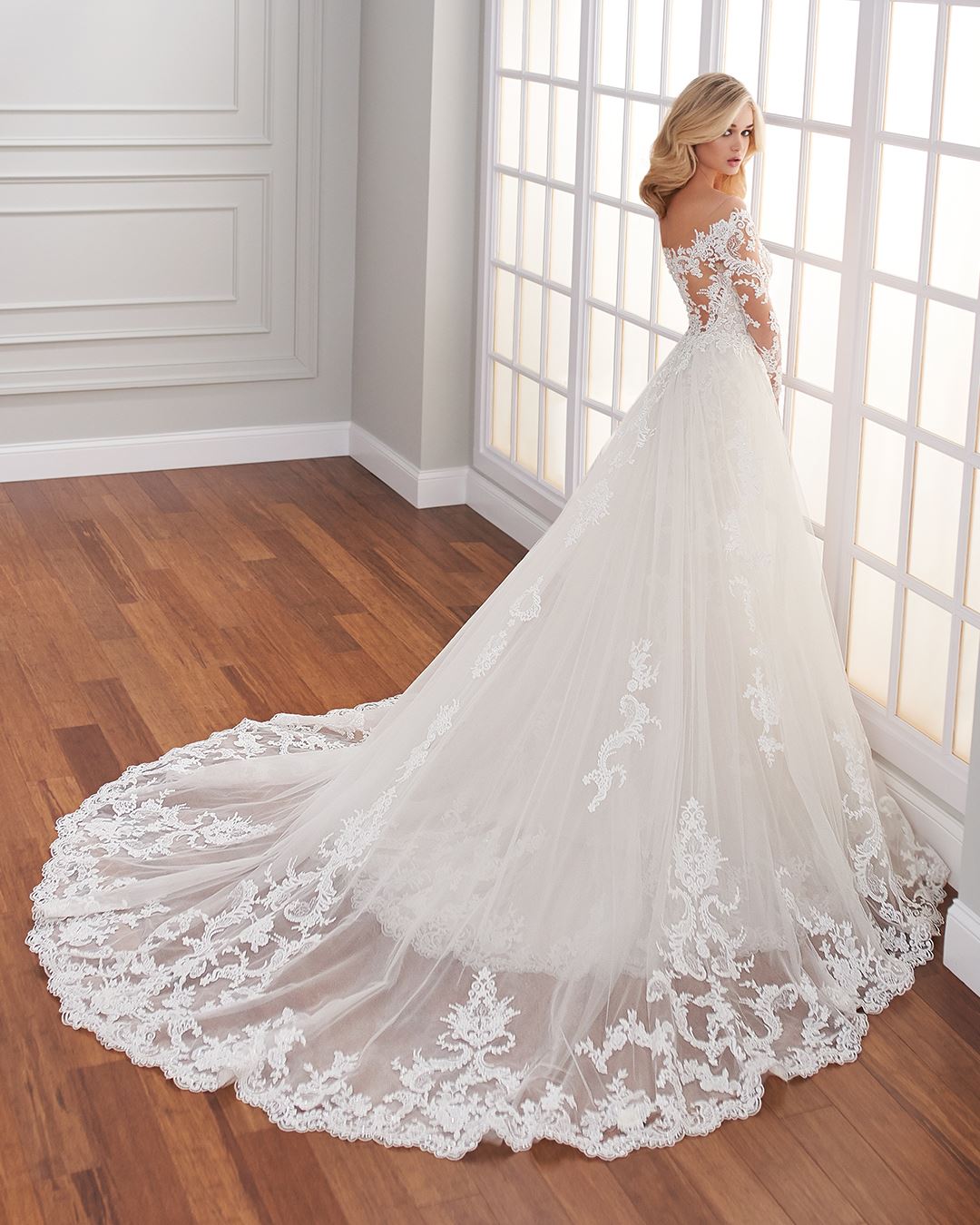 Bride wearing long sleeve lace wedding dress