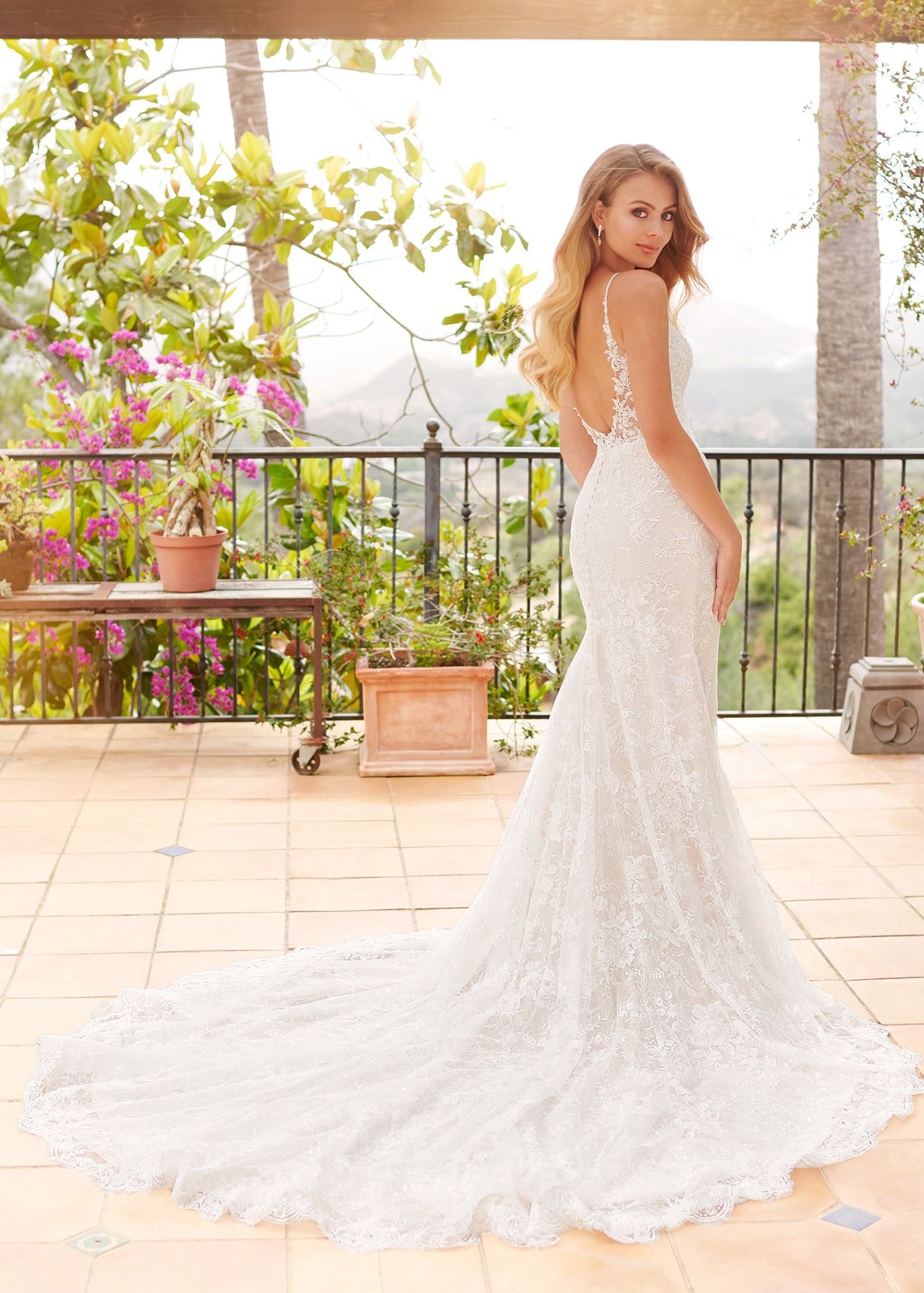Bride in lace fit and flare wedding dress by Martin Thornburg