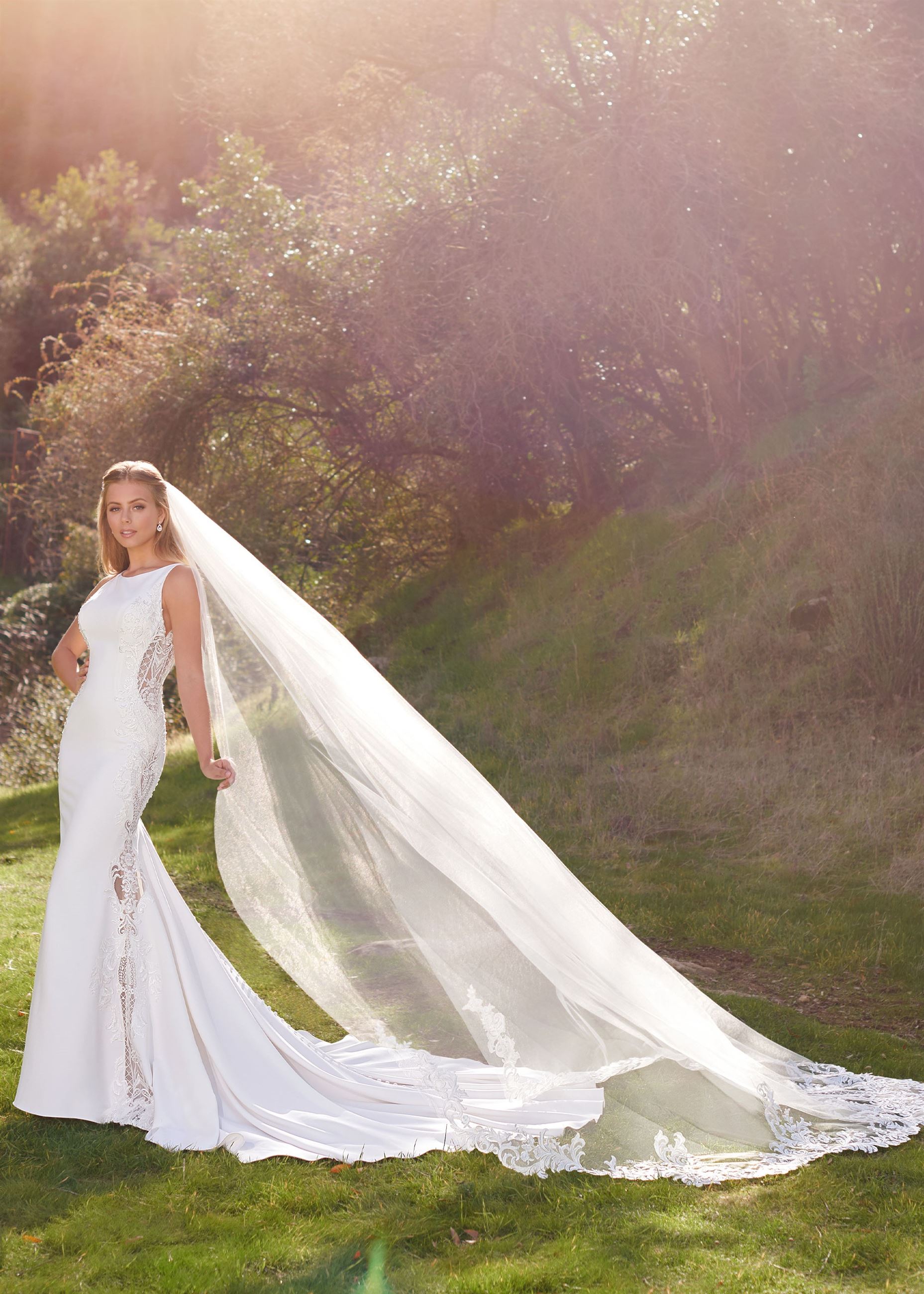 Bride wearing simple fit and flare wedding dress by Martin Thornburg